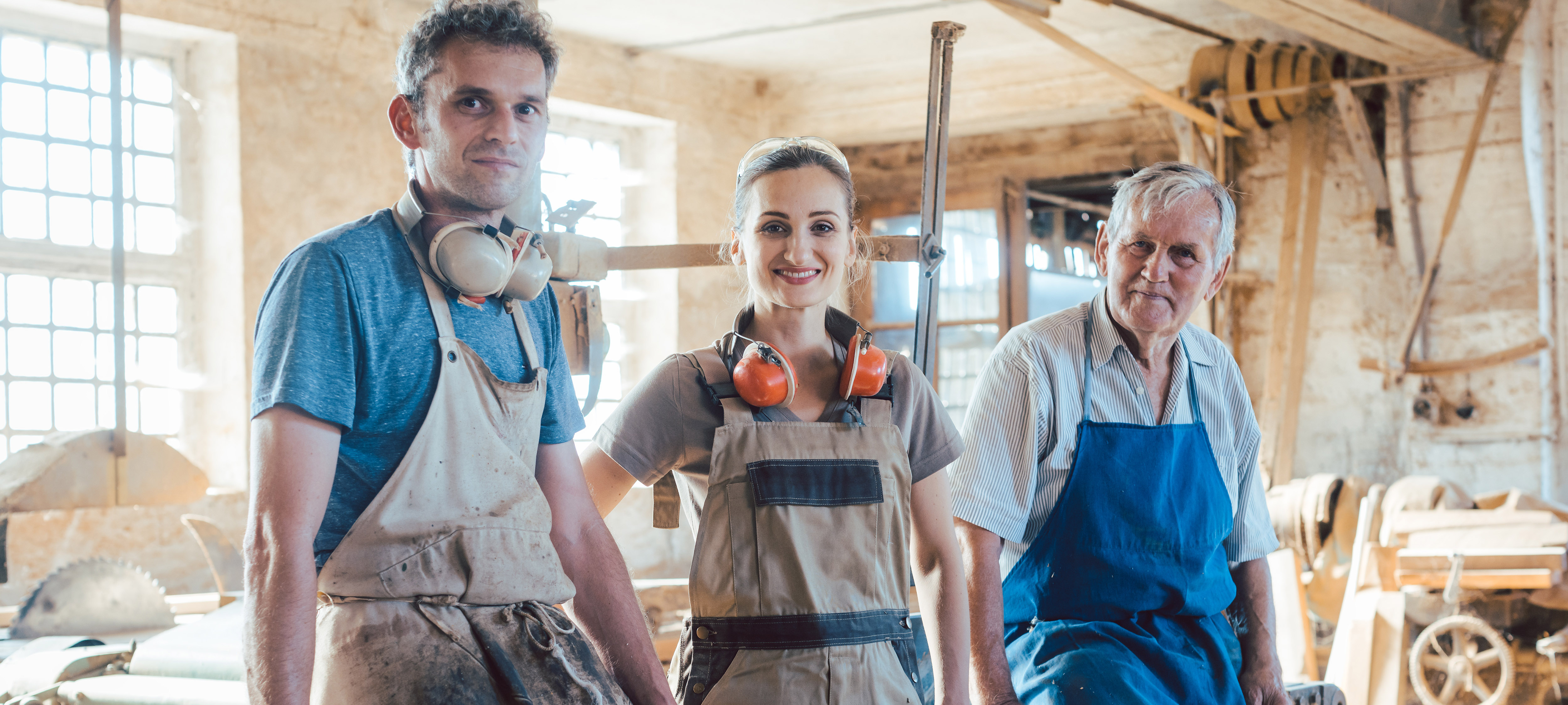 Carpenters with generations in the family business workshop | Understanding Valuation in a Family Business – vcfo blog